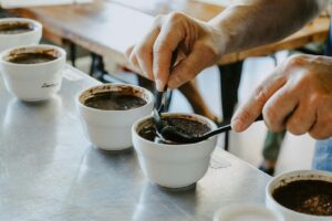 person mixing black coffee