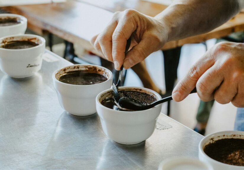 person mixing black coffee